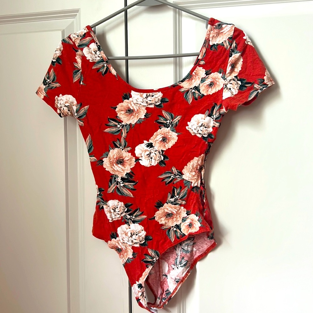 Orange floral bodysuit with rubbed sides from Charlotte Russe